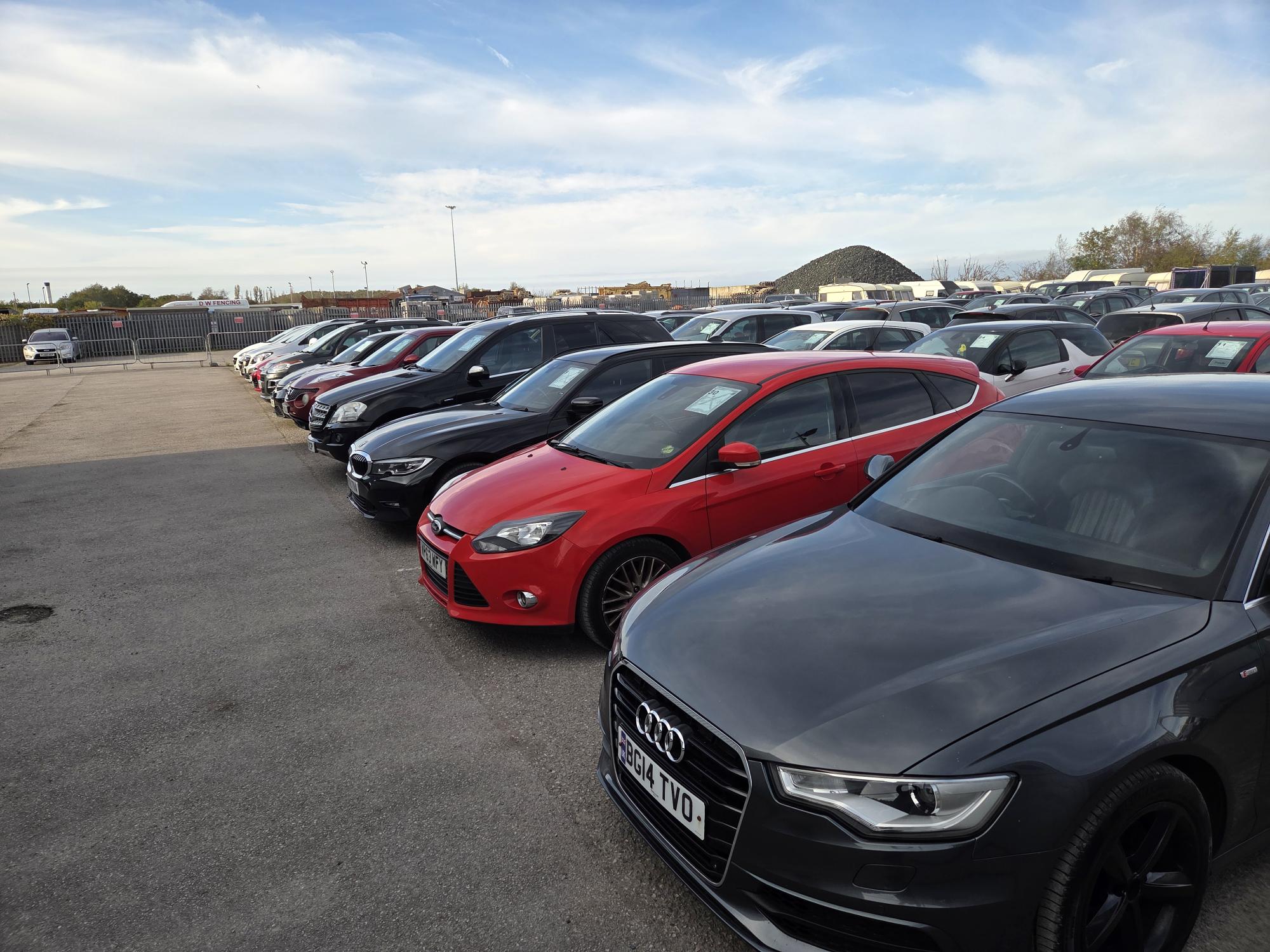 Cars in parking lot at Ellesmere Port Motor Auctions.